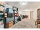 Spacious basement area featuring neutral carpet, shelving and storage containers and offering ample room for versatile usage at 4828 S Nucla Way, Aurora, CO 80015