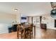 Open dining area with hardwood floors and a wooden table, perfect for Gathering meals and entertaining guests at 4828 S Nucla Way, Aurora, CO 80015