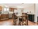 Dining area with wooden table and chairs, adjacent to the kitchen with stainless steel appliances at 4828 S Nucla Way, Aurora, CO 80015