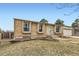 Brick home featuring well-maintained landscaping, a front yard, and an attached garage at 4828 S Nucla Way, Aurora, CO 80015