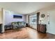 Cozy living room featuring hardwood floors, a large window and comfortable seating at 4828 S Nucla Way, Aurora, CO 80015