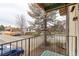 Balcony view overlooking surrounding residential area, mature trees, and parking area at 12180 Melody Dr # 203, Westminster, CO 80234
