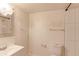 Compact bathroom equipped with essential fixtures including a toilet, sink, vanity, mirror, and shower at 12180 Melody Dr # 203, Westminster, CO 80234