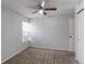 Carpeted bedroom featuring a closet and a ceiling fan at 12180 Melody Dr # 203, Westminster, CO 80234