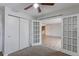 Cozy bedroom with neutral walls, carpet and bi-fold doors at 12180 Melody Dr # 203, Westminster, CO 80234