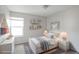 Cozy bedroom showcasing a comfortable bed, soft lighting, shelves and a calming ambiance at 12180 Melody Dr # 203, Westminster, CO 80234