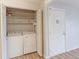 Washer and dryer located within an open closet laundry room with an external door at 12180 Melody Dr # 203, Westminster, CO 80234