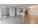 Open floor plan with updated kitchen, spacious living area, and french doors at 12180 Melody Dr # 203, Westminster, CO 80234