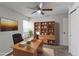 Functional home office equipped with a ceiling fan, desk, chair, shelving, and ample workspace at 12180 Melody Dr # 203, Westminster, CO 80234