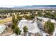 Overhead view of a community pool, slide and clubhouse in a picturesque setting at 19185 Shadowood Dr, Monument, CO 80132