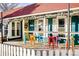 Charming ice cream shop exterior featuring colorful seating and cheerful decor at 19185 Shadowood Dr, Monument, CO 80132