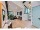 Inviting living room with bright blue door, large windows, hardwood floors, and modern decor at 19185 Shadowood Dr, Monument, CO 80132