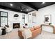 Bright living room featuring modern furnishings, a fireplace, with an open design and lots of natural light at 19185 Shadowood Dr, Monument, CO 80132