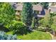 Beautiful home with mature trees and an inviting outdoor patio at 8136 S Glencoe Ct, Centennial, CO 80122