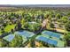 Aerial view of community with pool, tennis courts, and lush greenery at 8136 S Glencoe Ct, Centennial, CO 80122