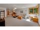 Finished basement featuring rec area, treadmill, and egress window at 8136 S Glencoe Ct, Centennial, CO 80122
