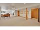 Spacious basement with neutral carpet and ample room for recreation and entertainment at 8136 S Glencoe Ct, Centennial, CO 80122