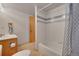 Clean bathroom featuring a bathtub with white tile surround and a modern vanity at 8136 S Glencoe Ct, Centennial, CO 80122