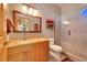 Bathroom featuring granite countertops, a walk-in shower, and soft gray paint at 8136 S Glencoe Ct, Centennial, CO 80122