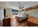 Cozy bedroom with hardwood floors, natural light, and wood trim at 8136 S Glencoe Ct, Centennial, CO 80122