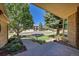 Well-maintained front yard with mature trees and beautiful landscaping at 8136 S Glencoe Ct, Centennial, CO 80122