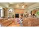 Inviting living room showcasing a brick fireplace and large windows at 8136 S Glencoe Ct, Centennial, CO 80122