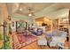 Open living space with hardwood floors, a fireplace, and a seamless transition to the kitchen at 8136 S Glencoe Ct, Centennial, CO 80122