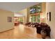 Spacious living room with hardwood floors, large windows, and an inviting atmosphere at 8136 S Glencoe Ct, Centennial, CO 80122