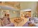 Inviting living room with hardwood floors and seamless transition to the dining room at 8136 S Glencoe Ct, Centennial, CO 80122