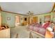 Spacious main bedroom featuring a ceiling fan, ensuite bath, and ample closet space at 8136 S Glencoe Ct, Centennial, CO 80122
