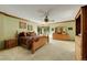 Serene main bedroom with neutral walls, carpet, and a ceiling fan at 8136 S Glencoe Ct, Centennial, CO 80122