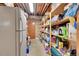 Walk-in pantry featuring tons of storage, shelving and extra refrigerator at 8136 S Glencoe Ct, Centennial, CO 80122