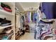 Walk-in closet with ample shelving and storage space for shoes, clothing, and accessories at 8136 S Glencoe Ct, Centennial, CO 80122