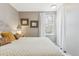 Bedroom with cozy bed, neutral gray walls, and a light floors at 1111 Maxwell Ave # 228, Boulder, CO 80304