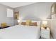 Bedroom with neutral gray walls, a comfortable bed and light floors at 1111 Maxwell Ave # 228, Boulder, CO 80304