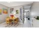 Bright dining area featuring modern art, wood floors, and access to stairs and other rooms at 1111 Maxwell Ave # 228, Boulder, CO 80304