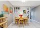Dining room with light wood table and chairs, modern art, and bright, natural light at 1111 Maxwell Ave # 228, Boulder, CO 80304