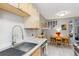 Bright eat-in kitchen with stainless steel sink, stainless appliances and light wood cabinets at 1111 Maxwell Ave # 228, Boulder, CO 80304