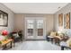 Comfortable and well-lit seating area with light walls and floors as well as a french door at 1111 Maxwell Ave # 228, Boulder, CO 80304