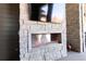 Modern outdoor fireplace set in stone, perfect for outdoor entertaining at 5429 S Kearney St, Greenwood Village, CO 80111