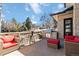 Outdoor patio with a built-in grill and bar, wicker furniture, and neighborhood views at 5429 S Kearney St, Greenwood Village, CO 80111