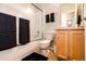 Neutral bathroom featuring a shower with glass doors and a wooden vanity at 452 Black Feather Loop # 608, Castle Rock, CO 80104