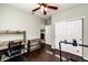 Versatile bedroom with workout space, desk, ceiling fan, and access to fireplace at 452 Black Feather Loop # 608, Castle Rock, CO 80104