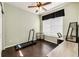 Bright bedroom featuring a ceiling fan, hardwood floors and a workspace at 452 Black Feather Loop # 608, Castle Rock, CO 80104