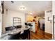 Open concept dining area leading to the kitchen with stylish table and hardwood floors at 452 Black Feather Loop # 608, Castle Rock, CO 80104