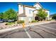 Attractive condo building with stone accents, manicured landscaping, and well-marked parking at 452 Black Feather Loop # 608, Castle Rock, CO 80104