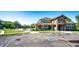 Community clubhouse featuring stone facade, covered entry and convenient visitor parking at 452 Black Feather Loop # 608, Castle Rock, CO 80104