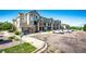 Well-maintained condo building with stone accents, convenient parking, and manicured landscaping at 452 Black Feather Loop # 608, Castle Rock, CO 80104
