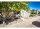 Attractive townhome with stone accents, lush tree, and well-maintained landscaping at 452 Black Feather Loop # 608, Castle Rock, CO 80104