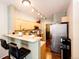 Cozy kitchen featuring a breakfast bar, stainless steel appliances and track lighting at 452 Black Feather Loop # 608, Castle Rock, CO 80104